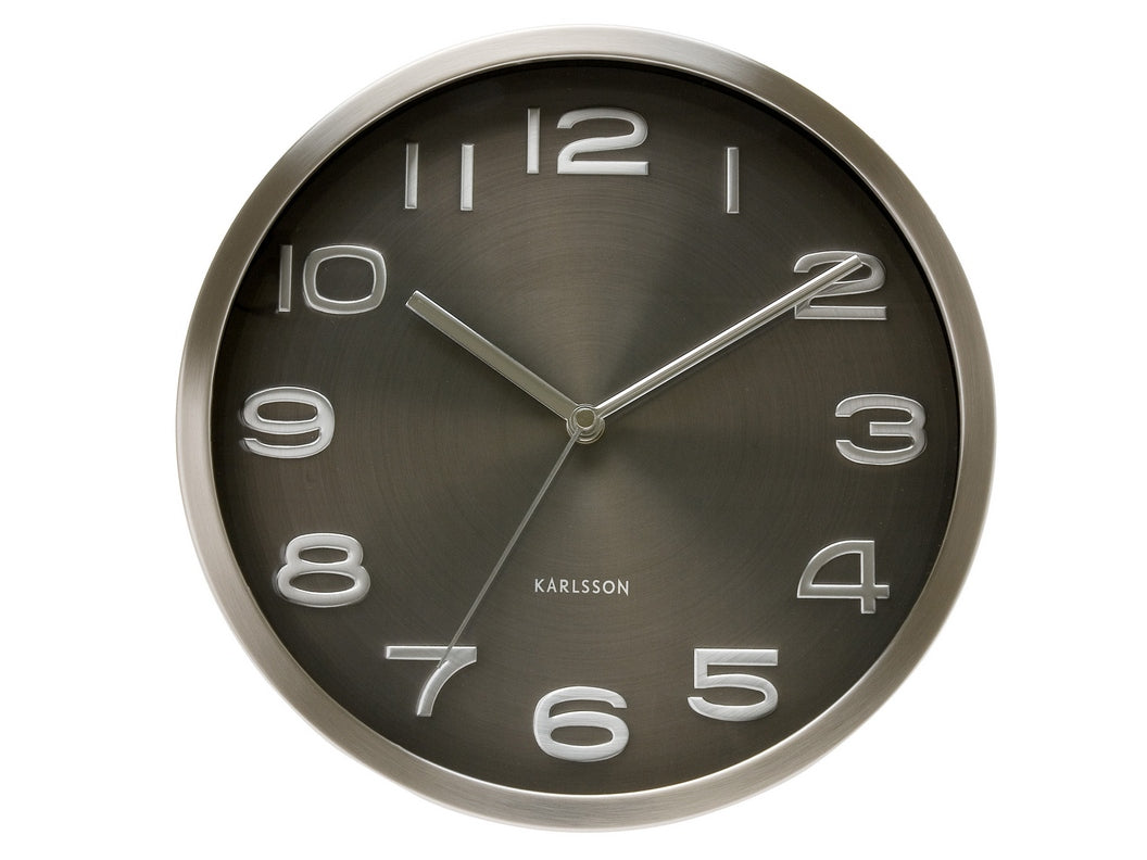 Maxie wall clock in Black, with a dark metallic dial in a brushed steel case