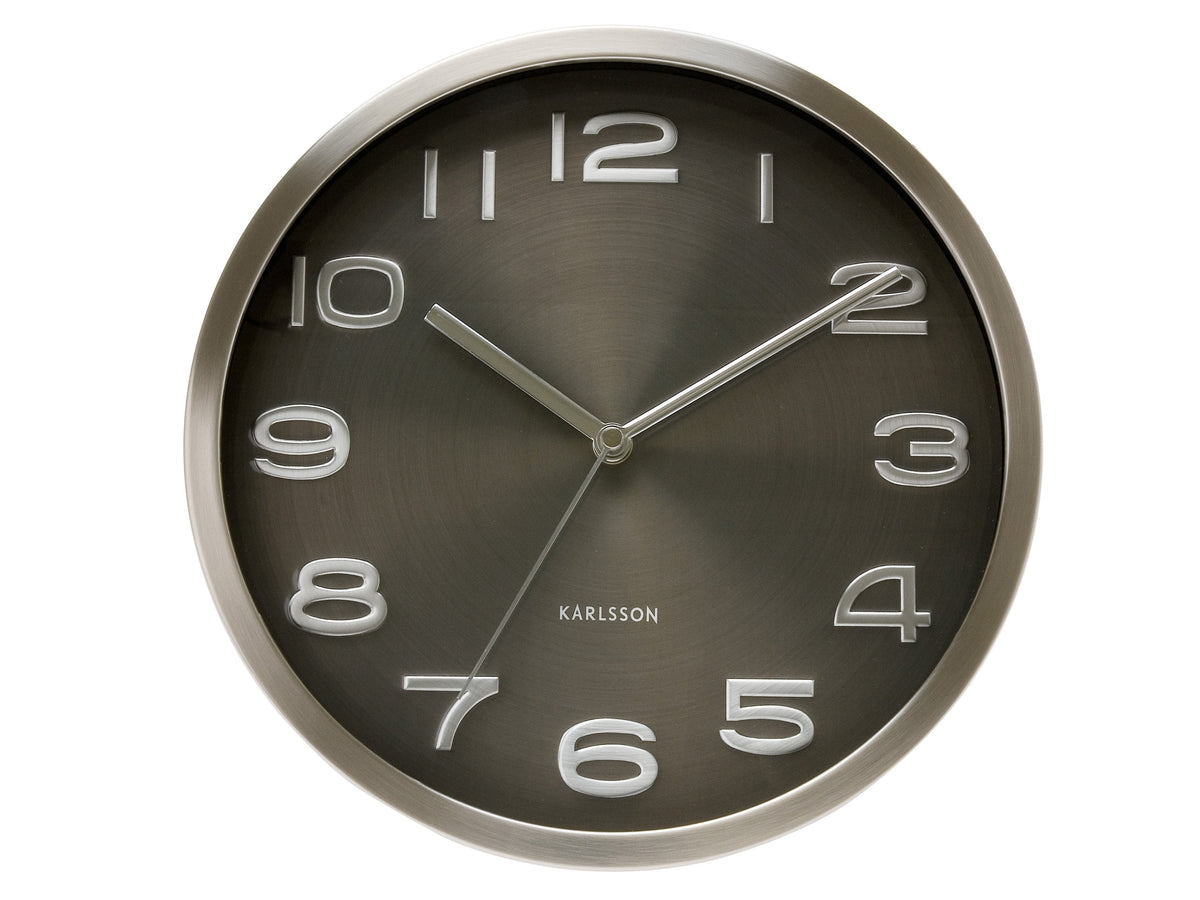 Maxie wall clock in Black, with a dark metallic dial in a brushed steel case