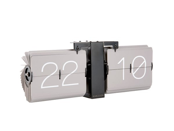 A Karlsson Flip Clock - Grey with a number of numbers on it.