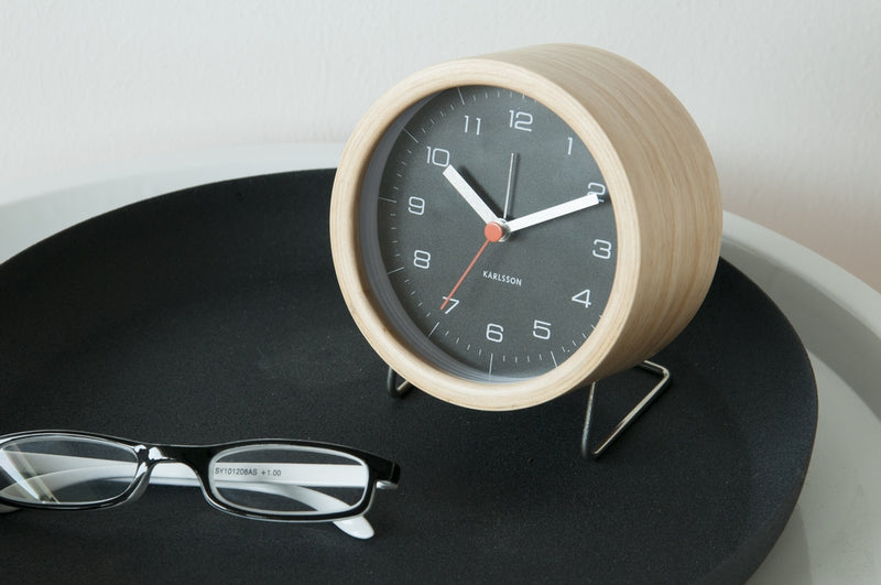 A black tray with a Karlsson Alarm Innate - Various Colours and glasses on it.