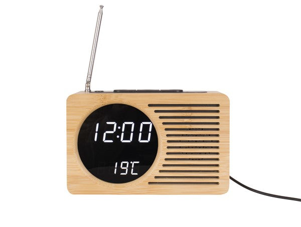 A minimal Karlsson Alarm Retro Radio with a wooden clock attached.