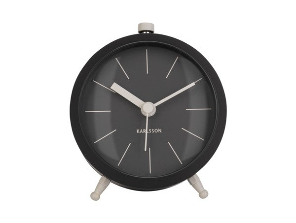 Karlsson Button Alarm Clock in black, front view on a white background