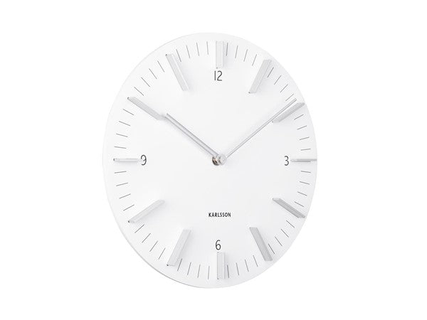 A Karlsson Clock - Detailed - Various Colours with a sweep movement on a white wall.