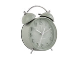 A green Karlsson Iconic alarm clock with a glass cover on a white background.
