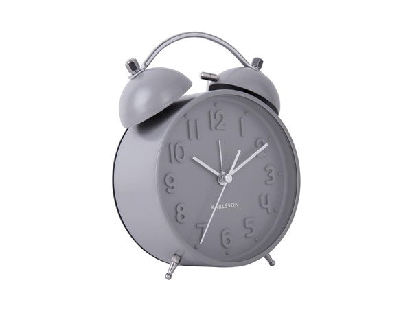 An Iconic Karlsson alarm clock with a glass cover on a white background.