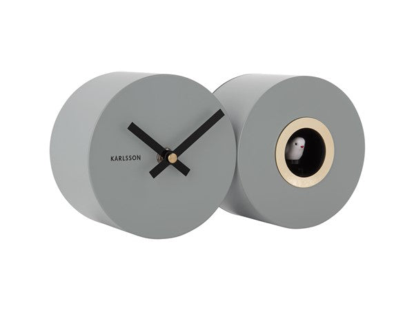 A Karlsson Duo Cuckoo clock with a grey face and a black face.