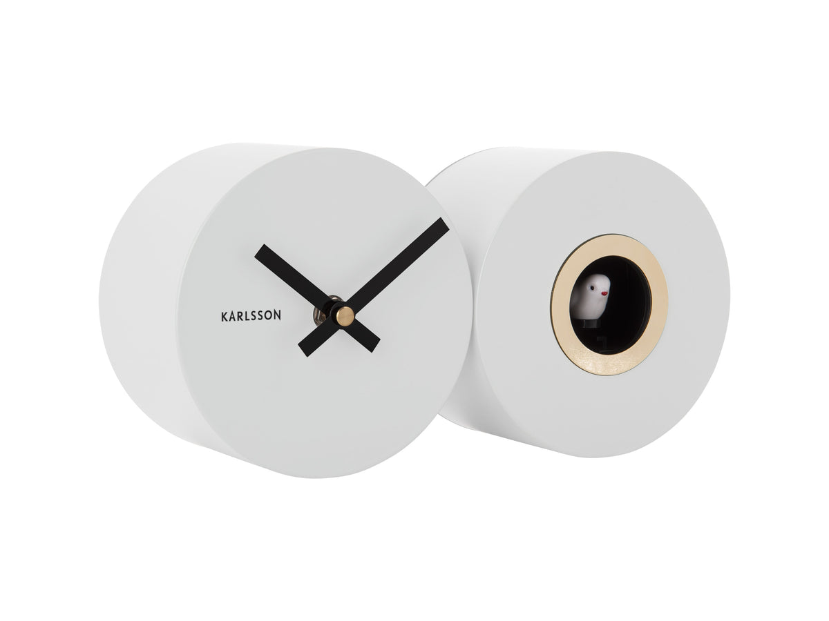 A Karlsson Duo Cuckoo clock with both a black face and a white face.
