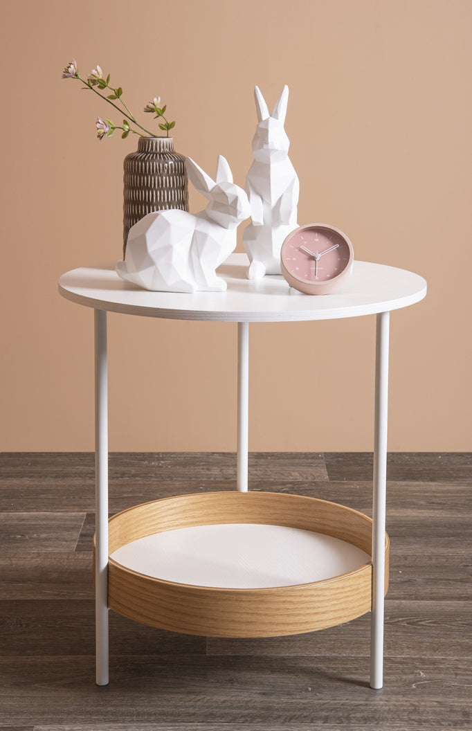 Aesthetic white table featuring two rabbits and a Karlsson Tinge Alarm Clock with a Scandinavian touch.
