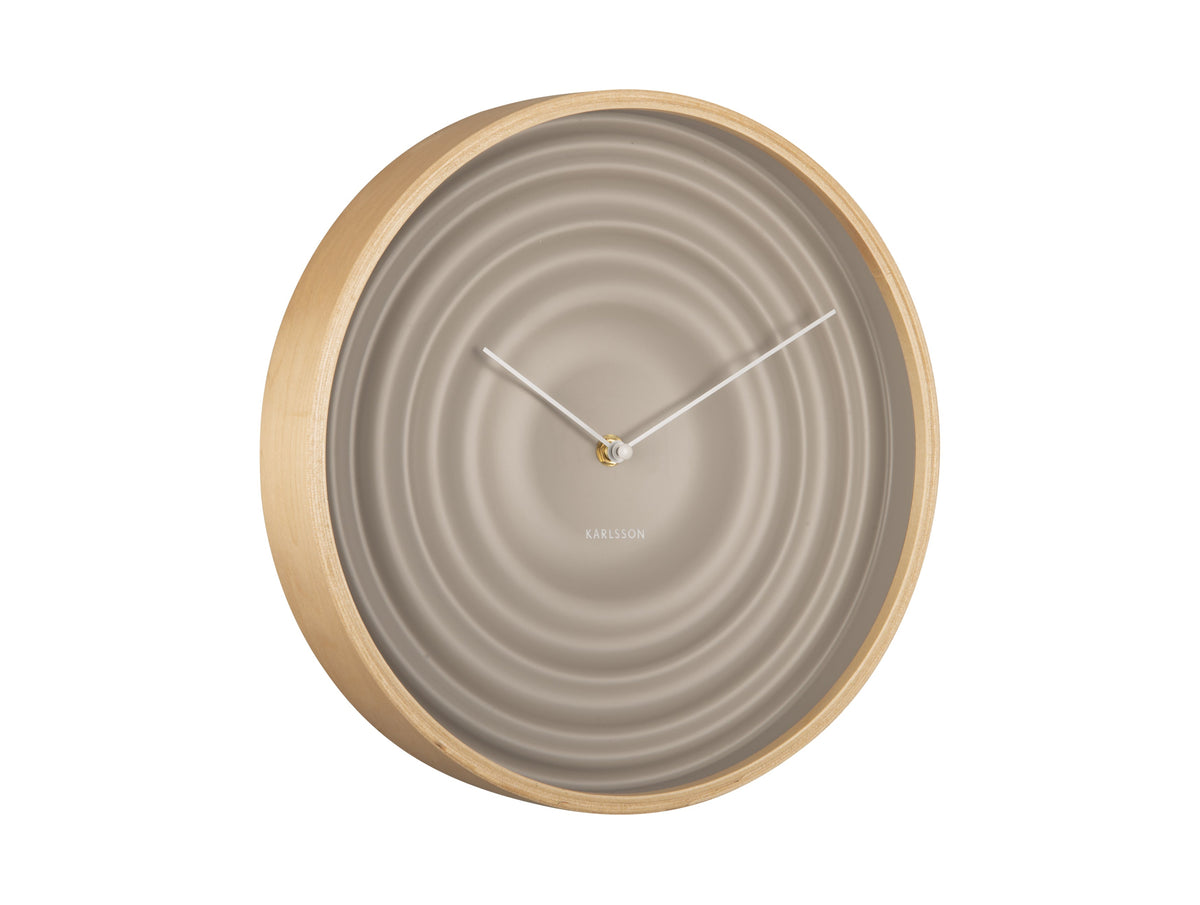 Grey Scandi Ribble wall clock with a light timber rim, angled view