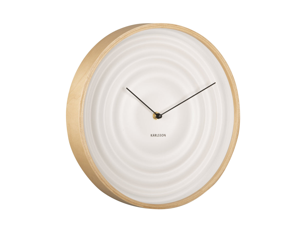 White Scandi Ribble wall clock with a light timber rim, angled view