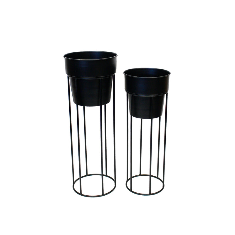 Two large Kenji Metal Floor Standing Planters in white and black by Pots & Planters on a white background.