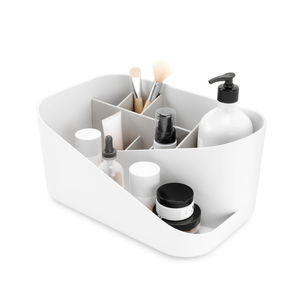 The Umbra Glam Cosmetic Organizer is a white container with storage compartments for cosmetics and brushes.