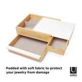 An Umbra STOWIT JEWELRY BOX NATURAL with hidden compartments and storage drawers, featuring a soft fabric lining to protect your jewelry from damage.