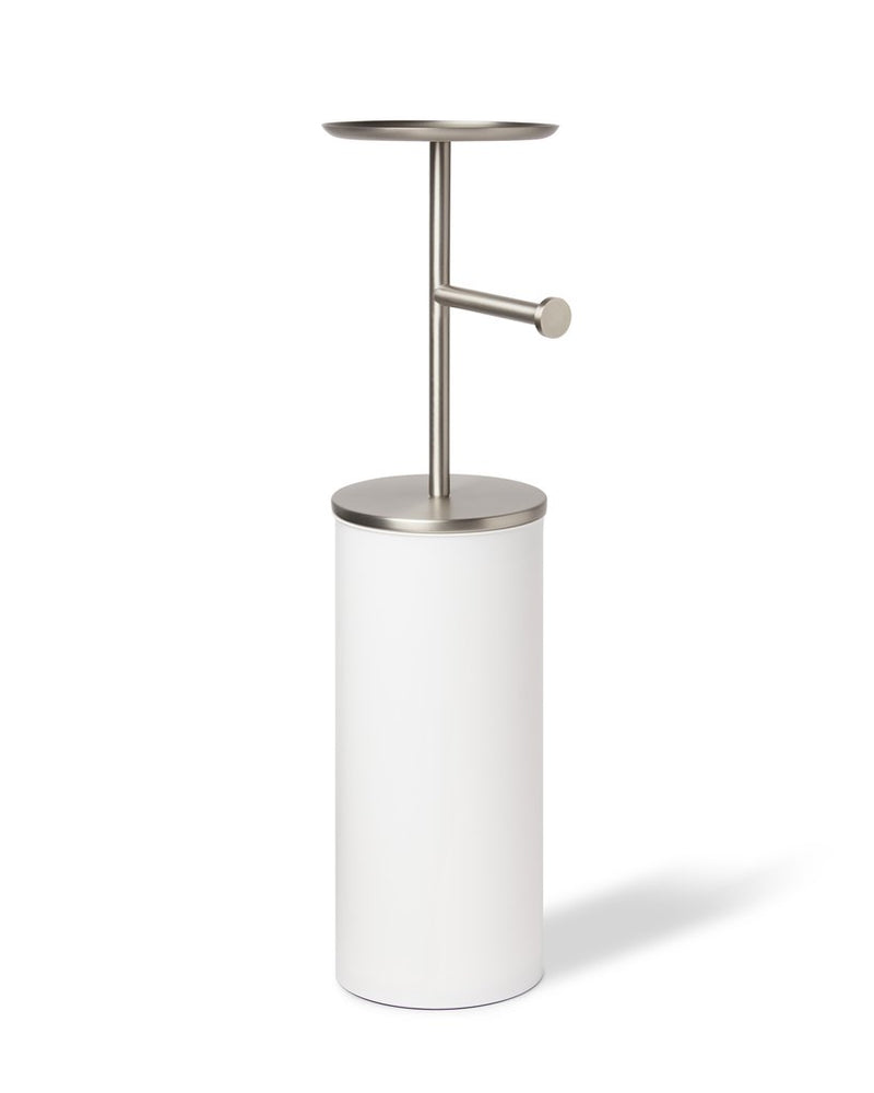 An Umbra Portaloo Toilet Paper Stand - White/Nickel sitting on a white background among bathroom appliances.