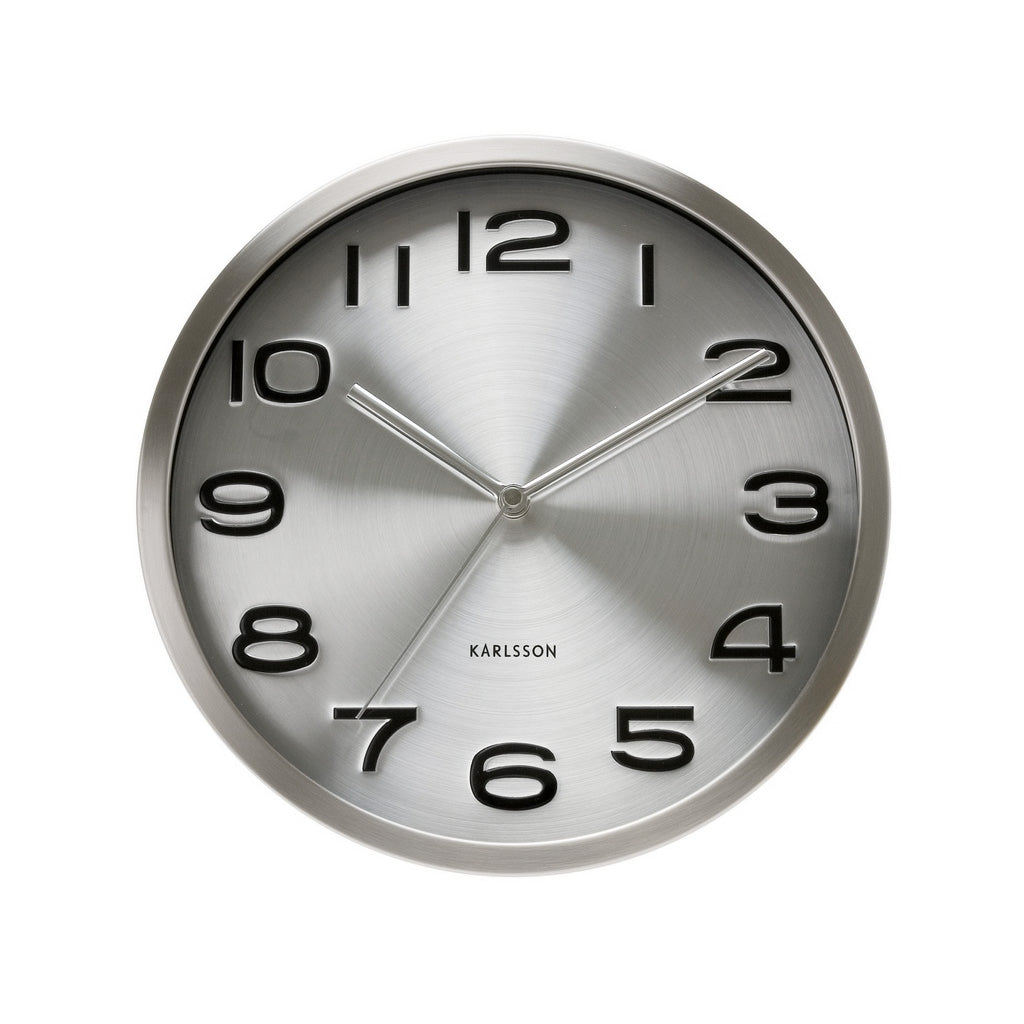 Maxie wall clock in Steel, with a silver metallic dial and bold raised numerals