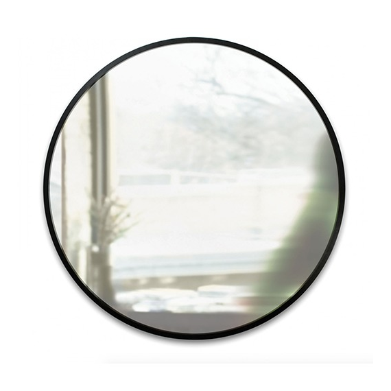 Umbra Hub 94cm round mirror with black rubber frame styled in an entryway