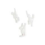 Three Umbra Buddy Hooks White - Set of 3 hanging on a white surface.