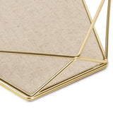 A modern Prisma Jewellery Tray - Matt Brass triangle shaped storage box from the Umbra range.