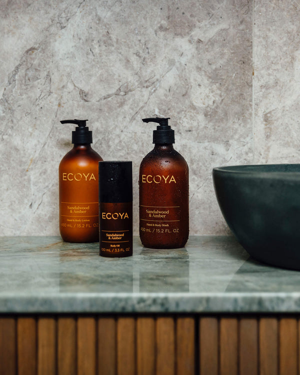 Scandinavian fragrance gift: Ecoya Limited Edition Sandalwood & Amber Hand & Body Wash on a bathroom counter.