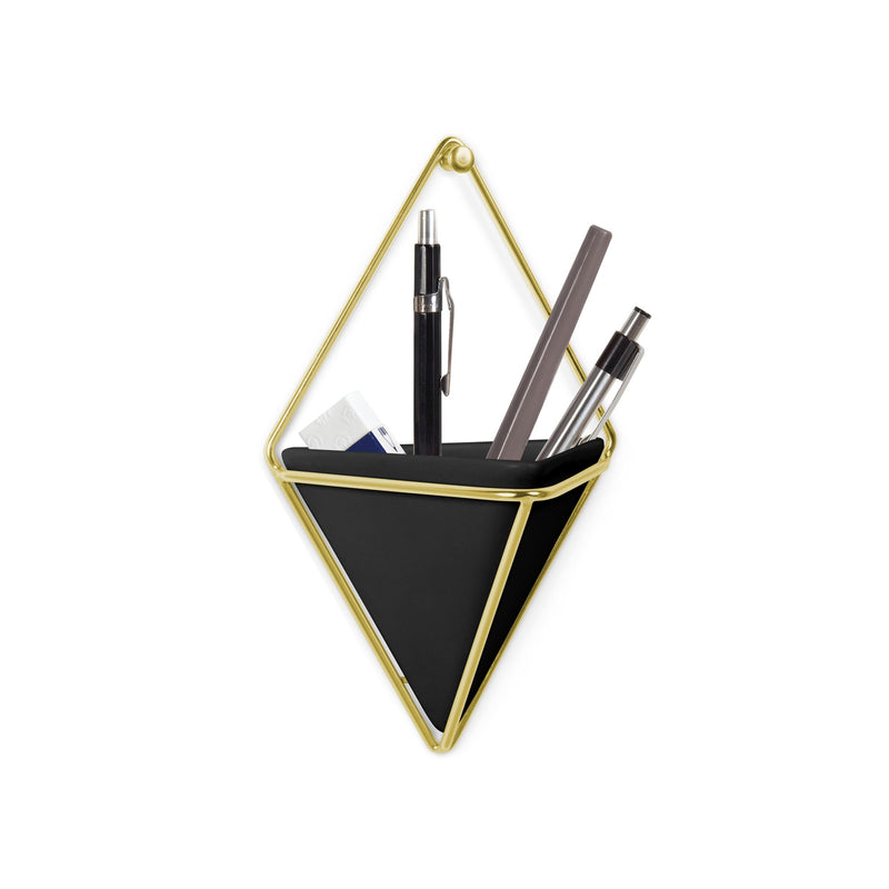 An Umbra Trigg Wall Vessel black and gold geometric pen holder with pens and pencils.