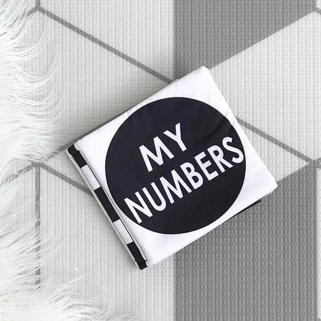 A black and white My Numbers | Luxe Soft Cover Book with high contrast images, perfect for learning numbers.