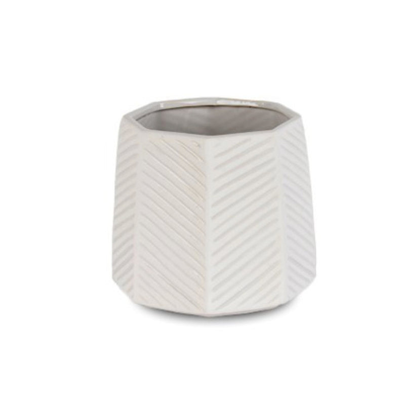 An Octo Planter White with a zig zag pattern, ideal for home decor.