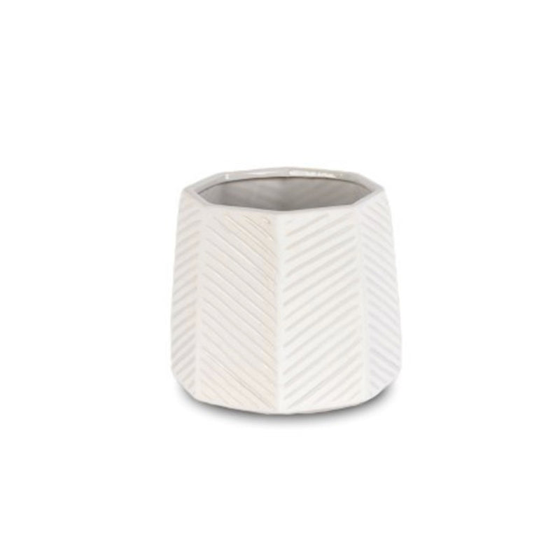 A white ceramic Octo Planter White by Pots & Planters with a zig zag pattern.