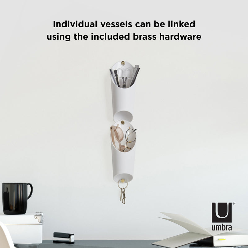 Individual vessels from the Umbra Floralink range can be linked using the included brass hardware, allowing for endless possibilities in creating a DIY green wall with the Floralink wall vessels.