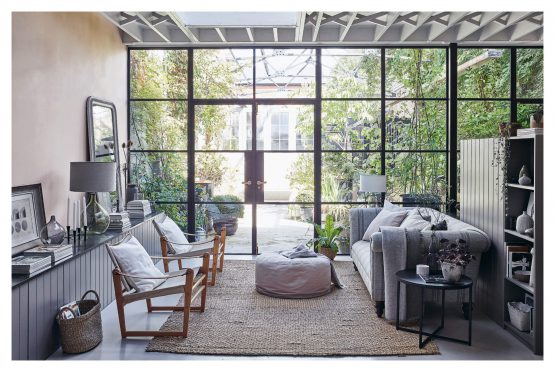 A living room with large windows and For The Love Of White: The White & Neutral Home furniture. Brand Name: Books