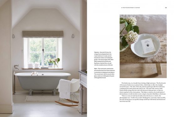A page from the book "For The Love Of White: The White & Neutral Home" showing a white bathroom with a bathtub.