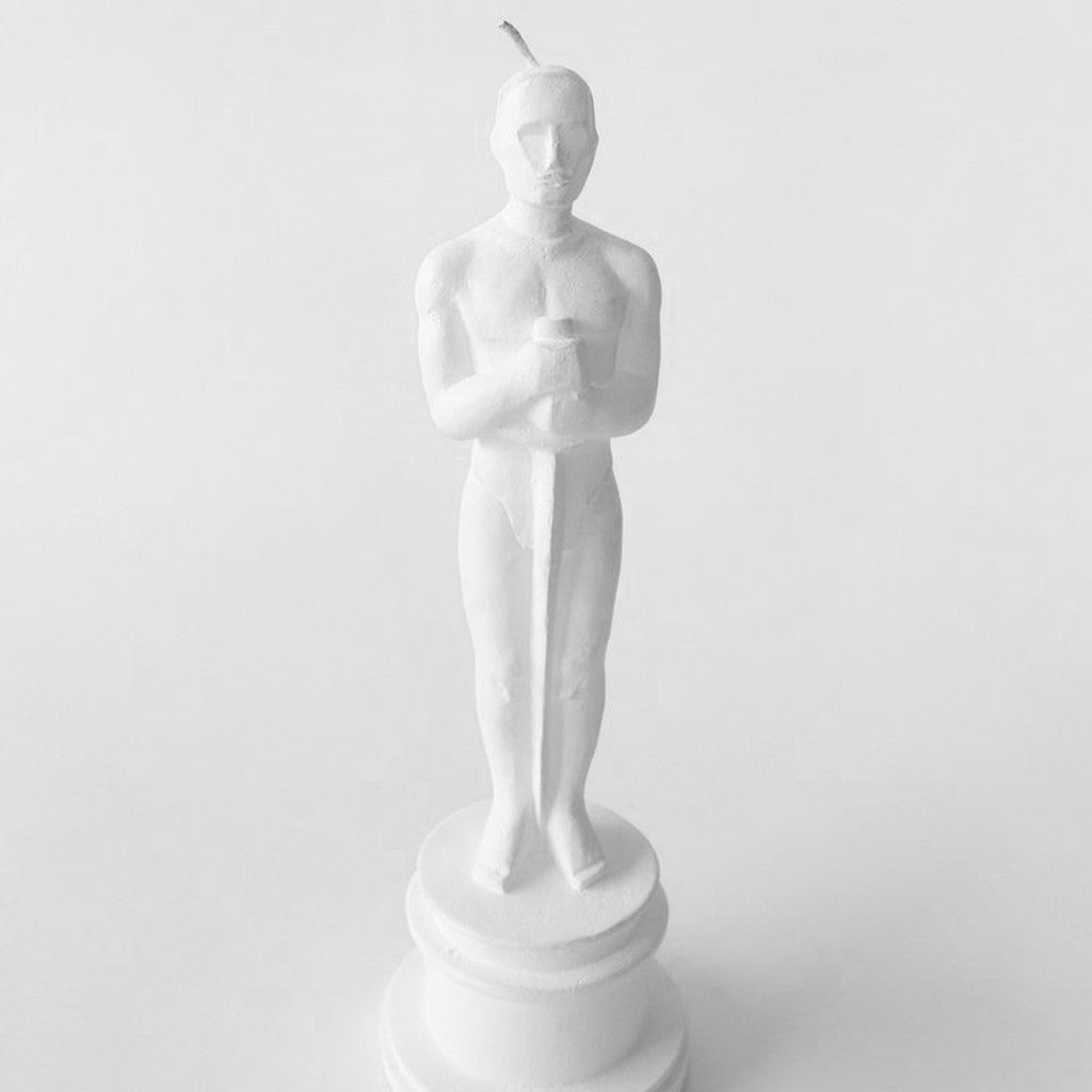 Oscar sculpted candle styled on a side table