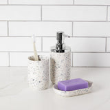 A bathroom with a Umbra-designed Junip Soap Pump - Terrazzo dispenser from the Junip collection.