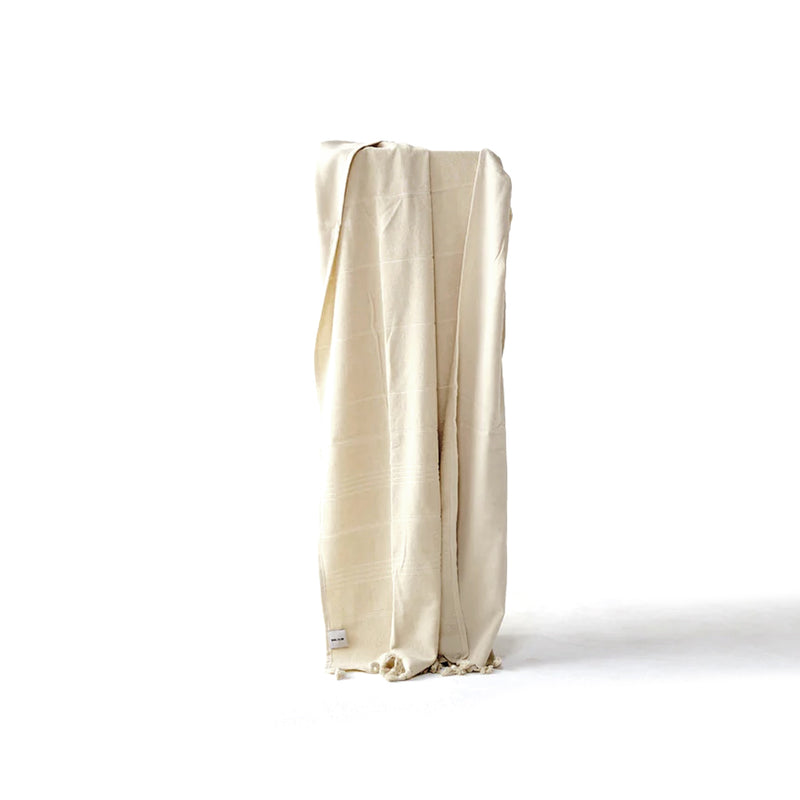 A lightweight and quick-dry TURKISH TOWEL – PALM TREE blanket by Brel Club.