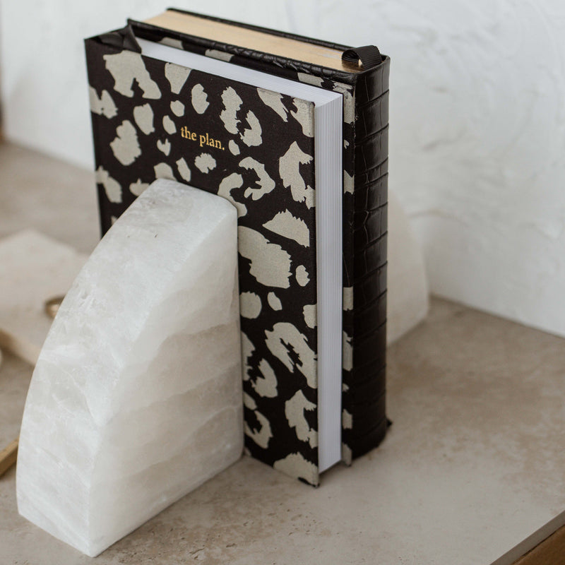 A limited edition pair of Stone Rounded Bookends from Papier HQ's stationery range featuring a leopard print design.