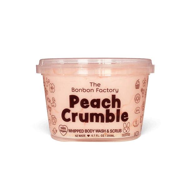 A container of peach crumble body wash whip by The Bonbon Factory on a white background.