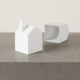 Two Scandinavian-inspired Umbra Casa Tissue Box Cover White boxes serving as stylish decor with a house on top.