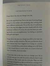 An open book featuring a quote from The Pivot Year - Brianna Wiest by Thought Catalog, blending elements of self-help and journaling.