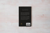 The self-help journal "The Pivot Year" by Brianna Wiest, with a black cover and published by Thought Catalog.