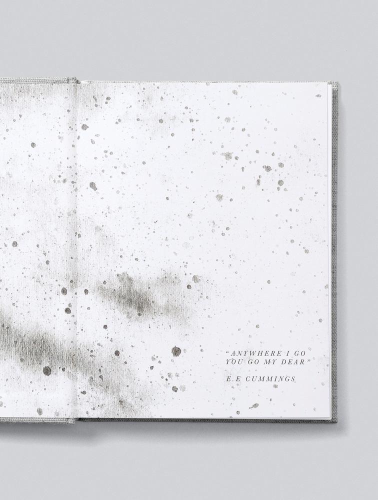 Bump journal opened to show its speckled watercolour endpapers and quote