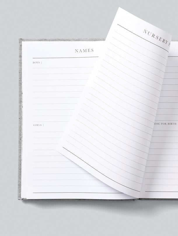 A Write To Me pregnancy journal with a white cover and blank pages named "9 Months - The Beginning Of You".