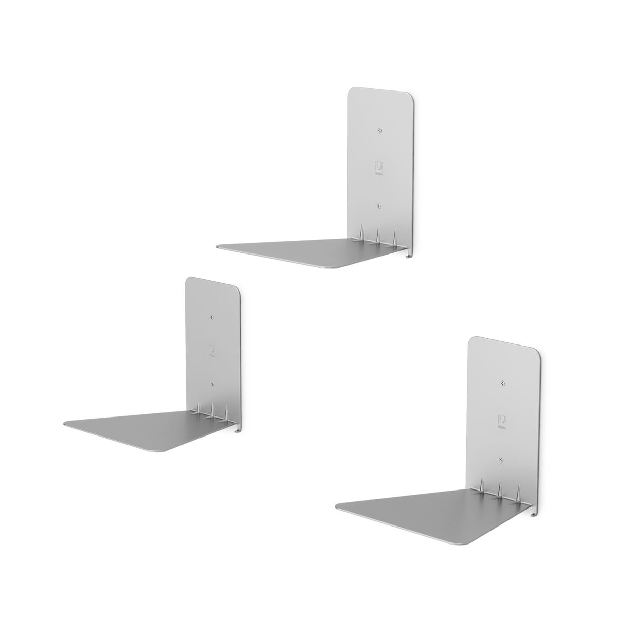 Three Umbra Conceal 3 Pack - Silver floating white shelf brackets on a black background.