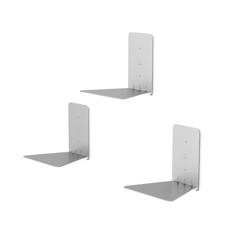 Three Umbra Conceal 3 Pack - Silver floating white shelf brackets on a black background.