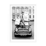 A woman sitting on top of a mini cooper in a black and white RETAIL THERAPY by Art Prints - prints delivery.