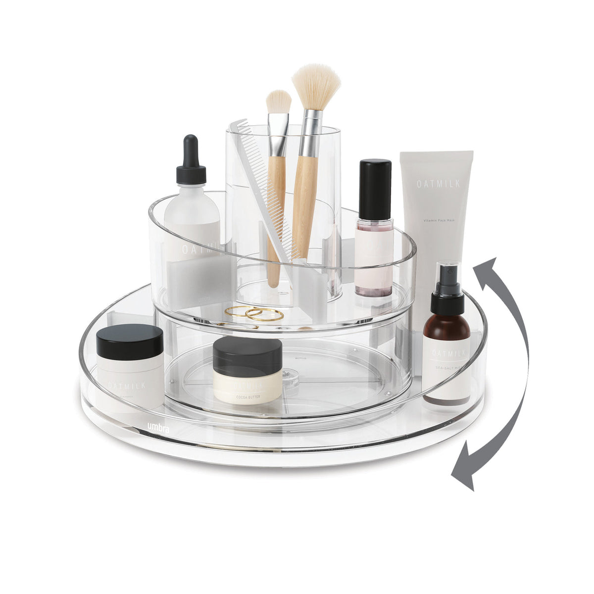 Umbra Cascada clear acrylic rotating cosmetic organizer with makeup