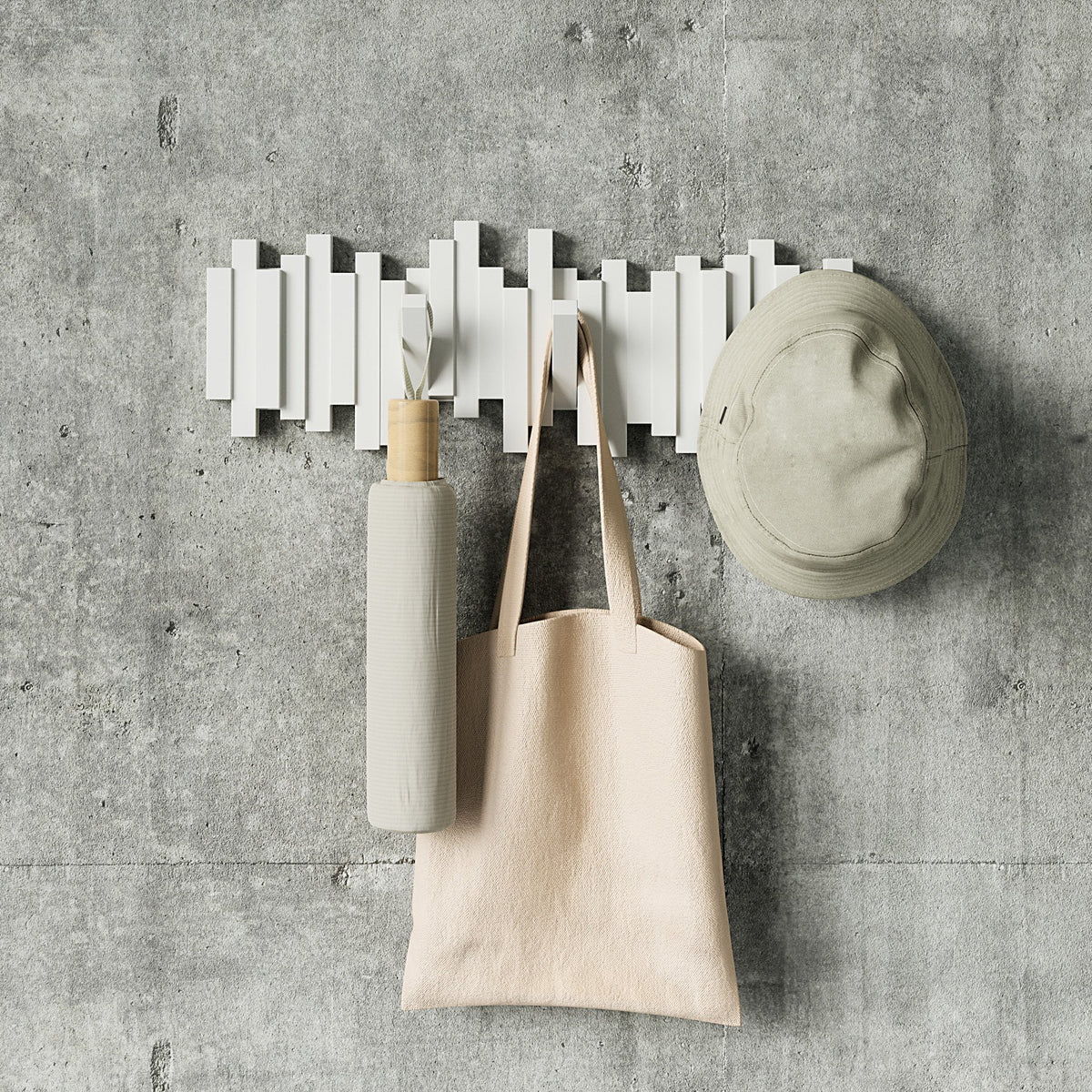 Umbra Sticks white sculptural wall hook rack with flip-down hooks