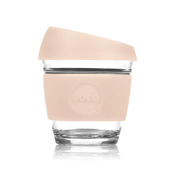 Joco Cups | Takeaway Cup - 8oz with a pink lid on a white surface.