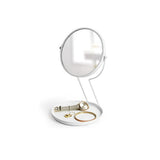 An Umbra See Me - White Mirror vanity mirror with a key holder on top of it.