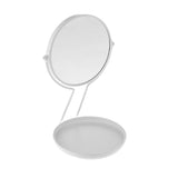 An Umbra See Me - White Mirror placed on a white surface.