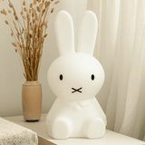 A medium-sized Miffy Star Light - DIMMABLE, MOOD LIGHTING by Mr Maria sits on a table.