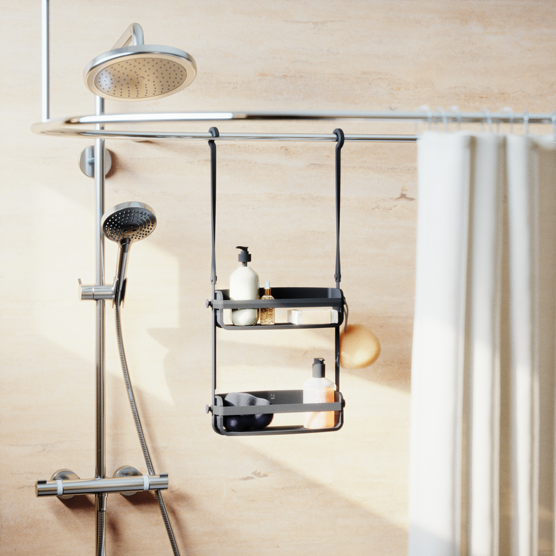 A bathroom with a shower curtain and an Umbra FLEX SHOWER CADDY - Black / White.